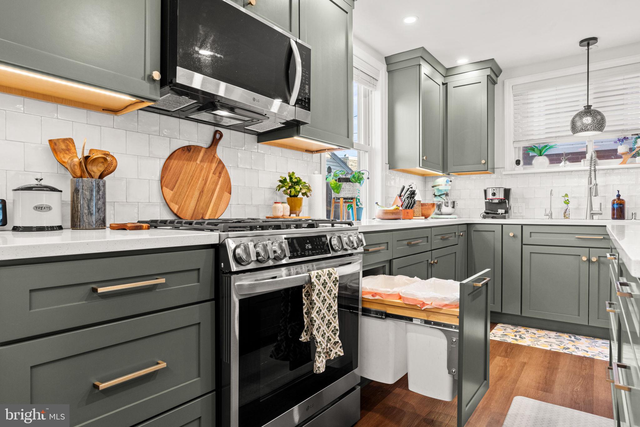 319 North Reservoir Street Lancaster, PA 17602 - Photo 11 of 44 a kitchen with stainless steel appliances granite countertop a stove and a sink