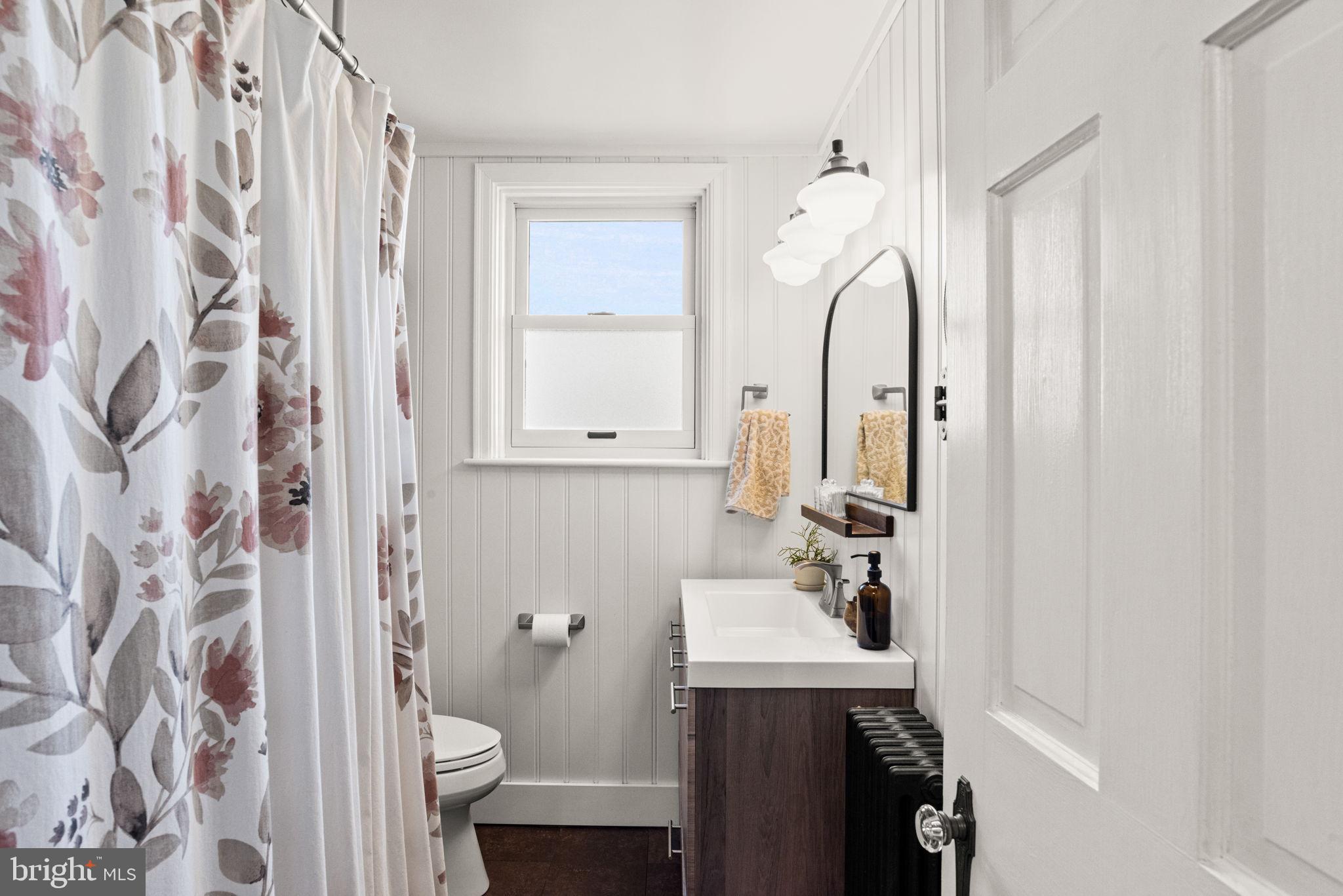 319 North Reservoir Street Lancaster, PA 17602 - Photo 20 of 44 a bathroom with a sink and mirror with toilet