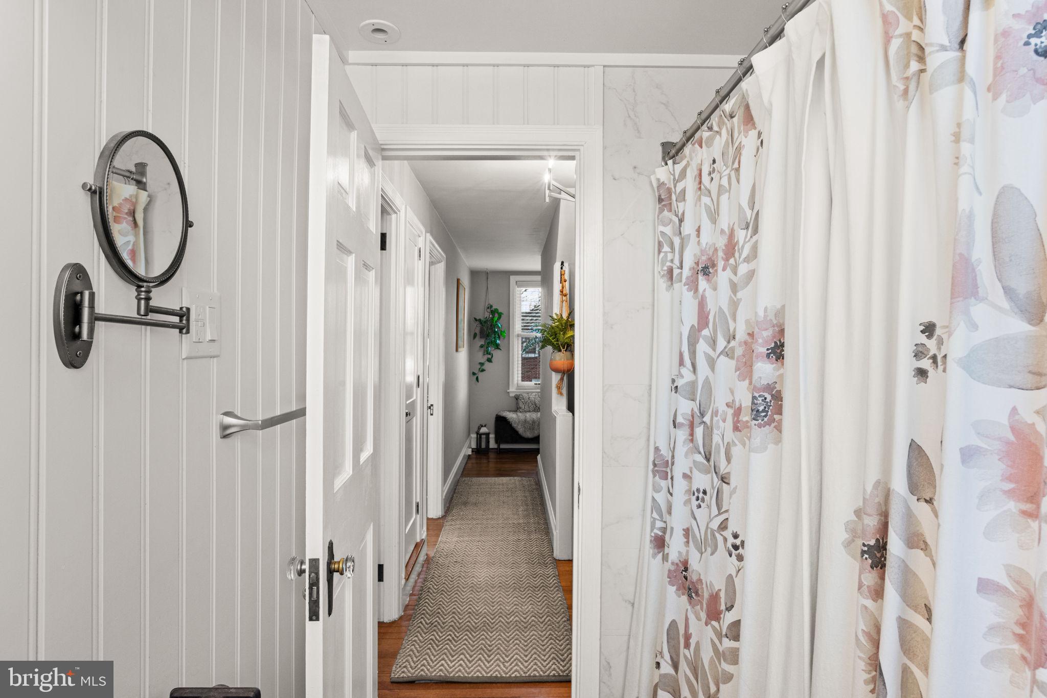 319 North Reservoir Street Lancaster, PA 17602 - Photo 21 of 44 a bathroom with a large mirror a shower and a window