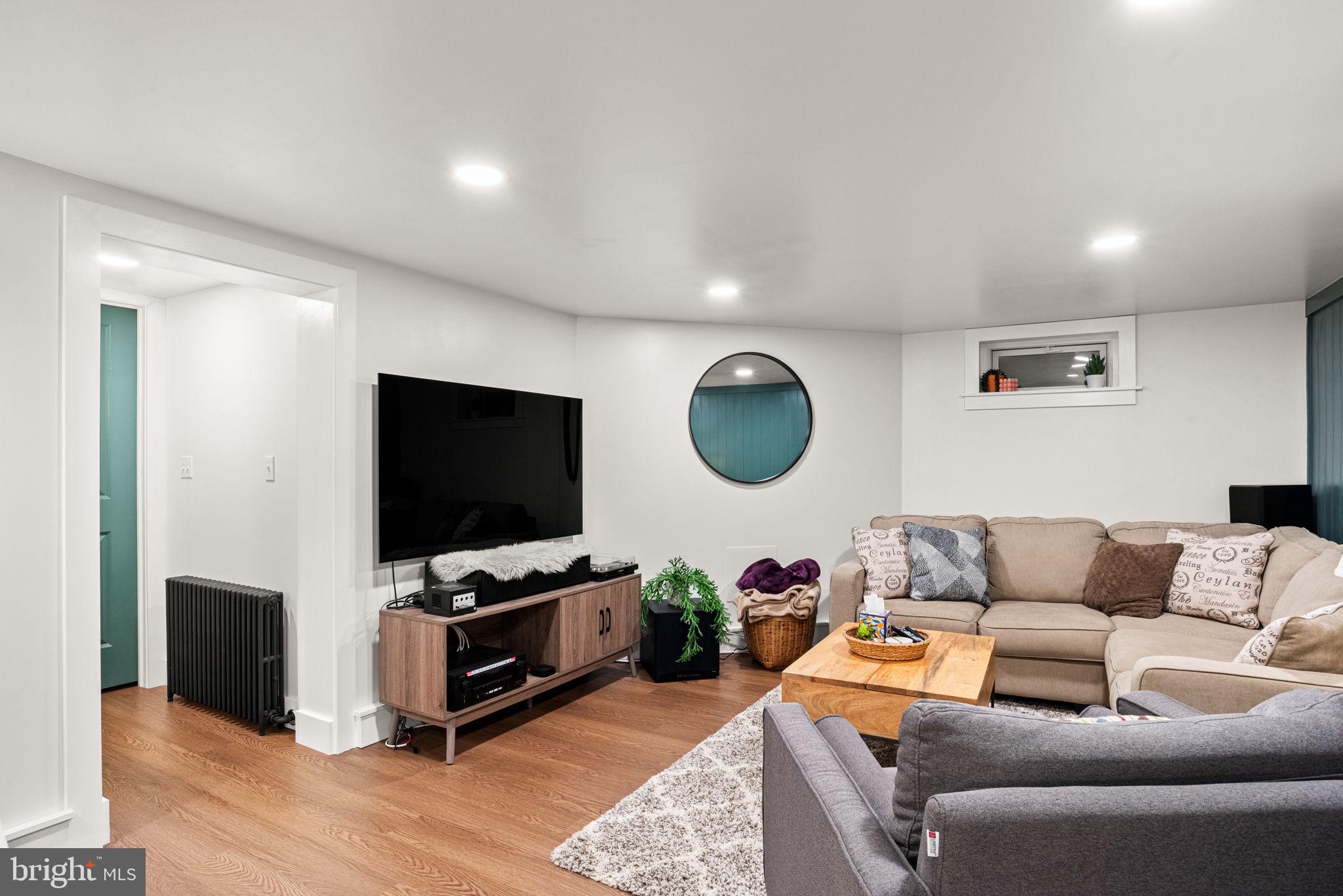 319 North Reservoir Street Lancaster, PA 17602 - Photo 32 of 44 a living room with furniture and a flat screen tv