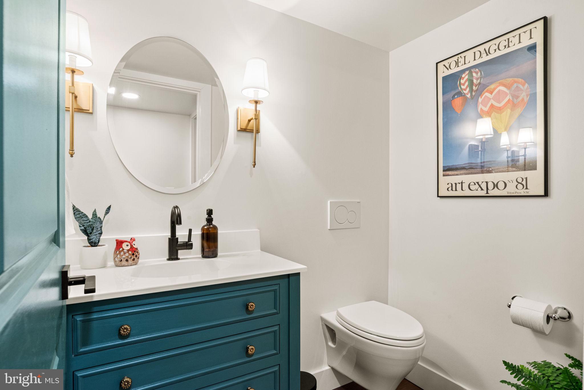 319 North Reservoir Street Lancaster, PA 17602 - Photo 34 of 44 a bathroom with a toilet a sink and mirror