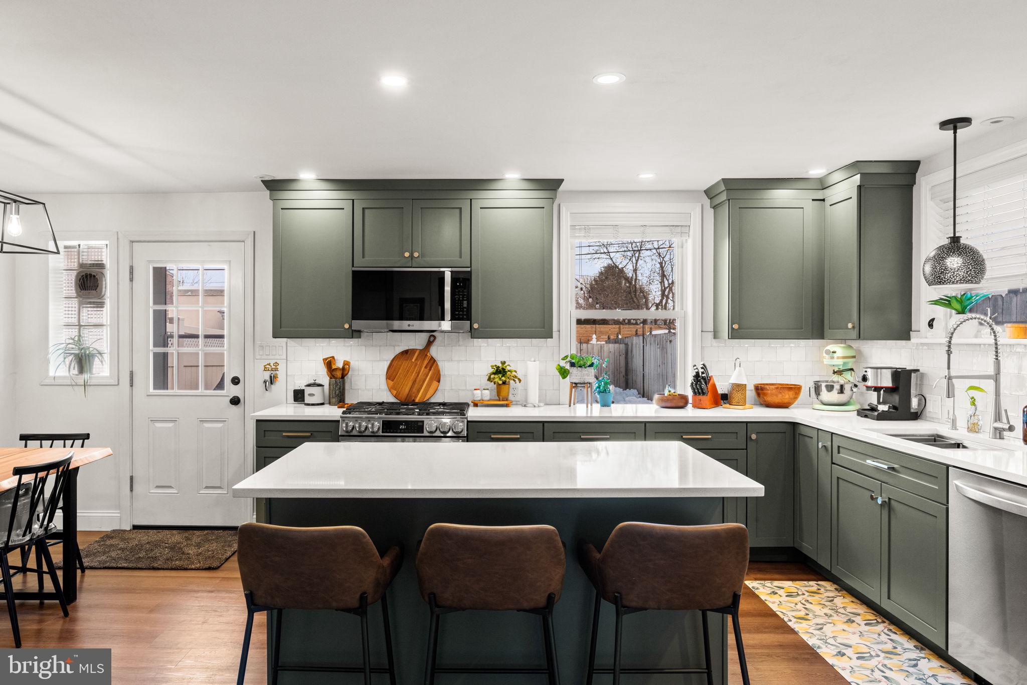 319 North Reservoir Street Lancaster, PA 17602 - Photo 10 of 44 a kitchen with a dining table chairs and a refrigerator