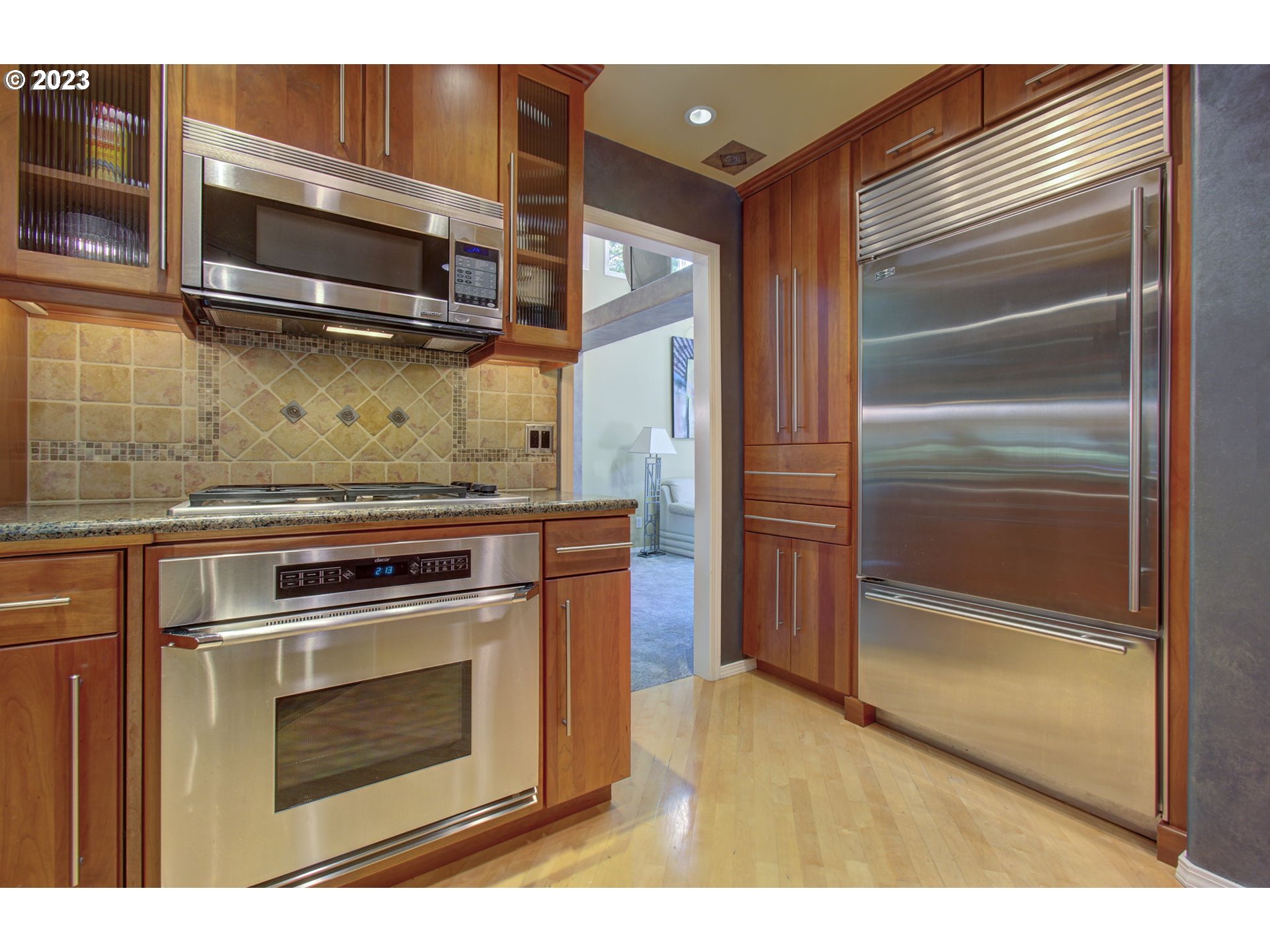 2407 Northeast 165th Street Ridgefield, WA 98642 - Photo 12 of 46 a kitchen with a stove and a microwave