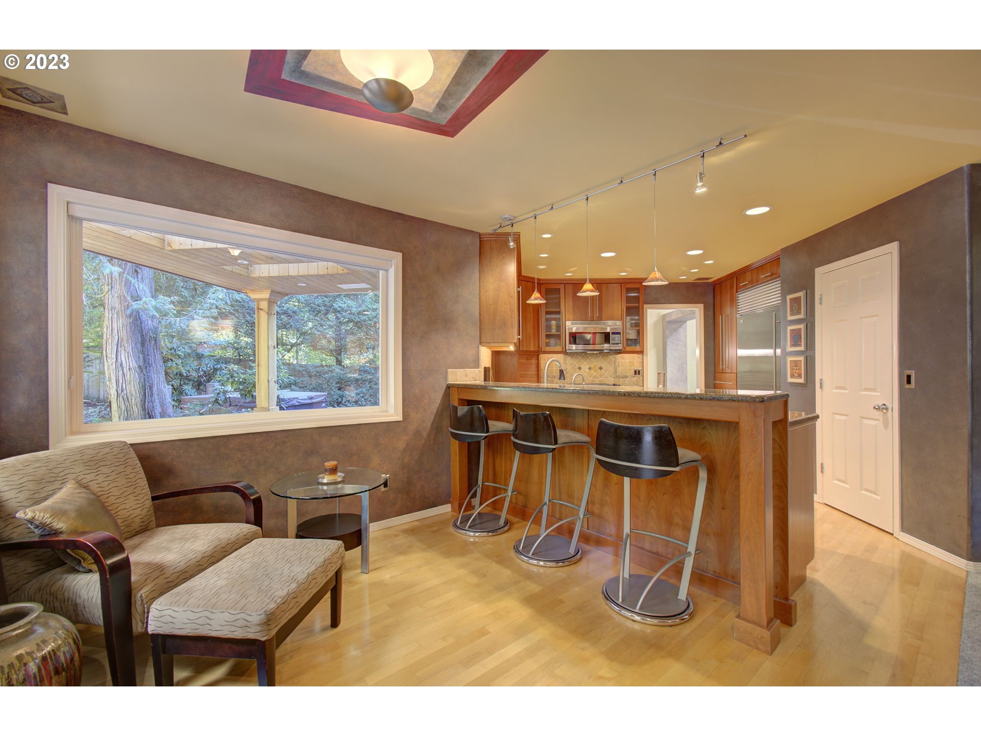 2407 Northeast 165th Street Ridgefield, WA 98642 - Photo 14 of 46 a dining room with furniture and a large window