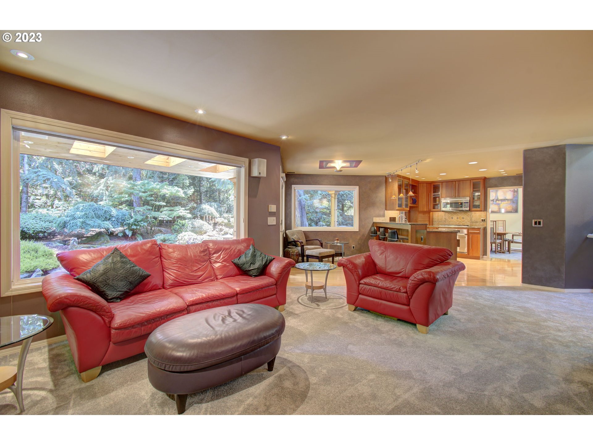 2407 Northeast 165th Street Ridgefield, WA 98642 - Photo 16 of 46 a living room with furniture a large window and a table
