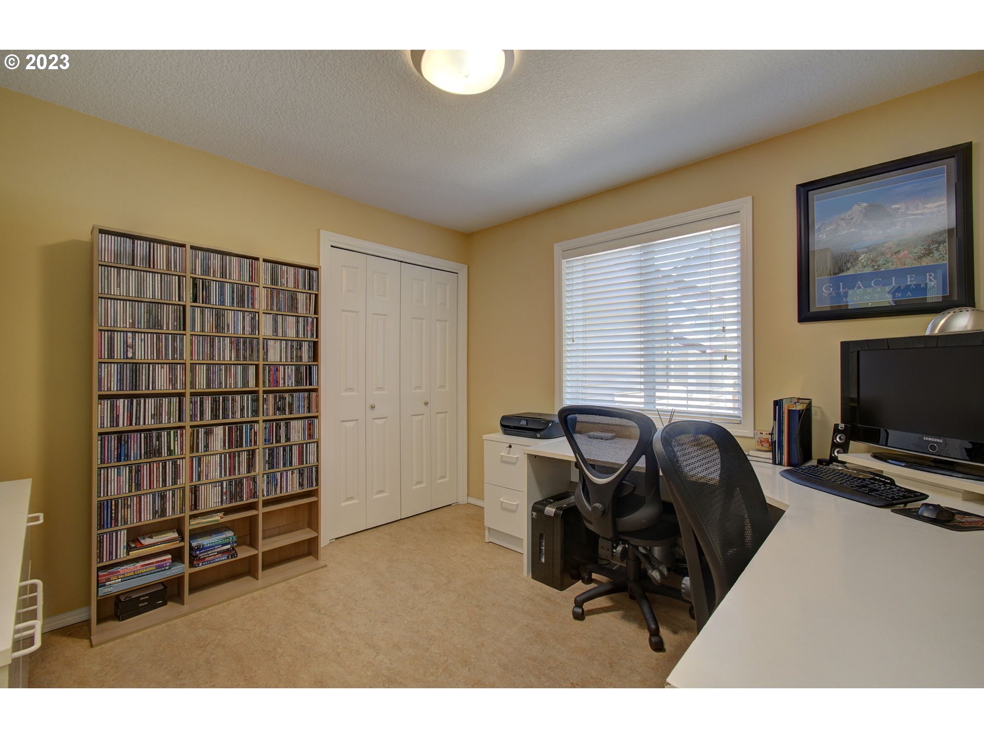 2407 Northeast 165th Street Ridgefield, WA 98642 - Photo 20 of 46 a living room with furniture a flat screen tv and gym equipment