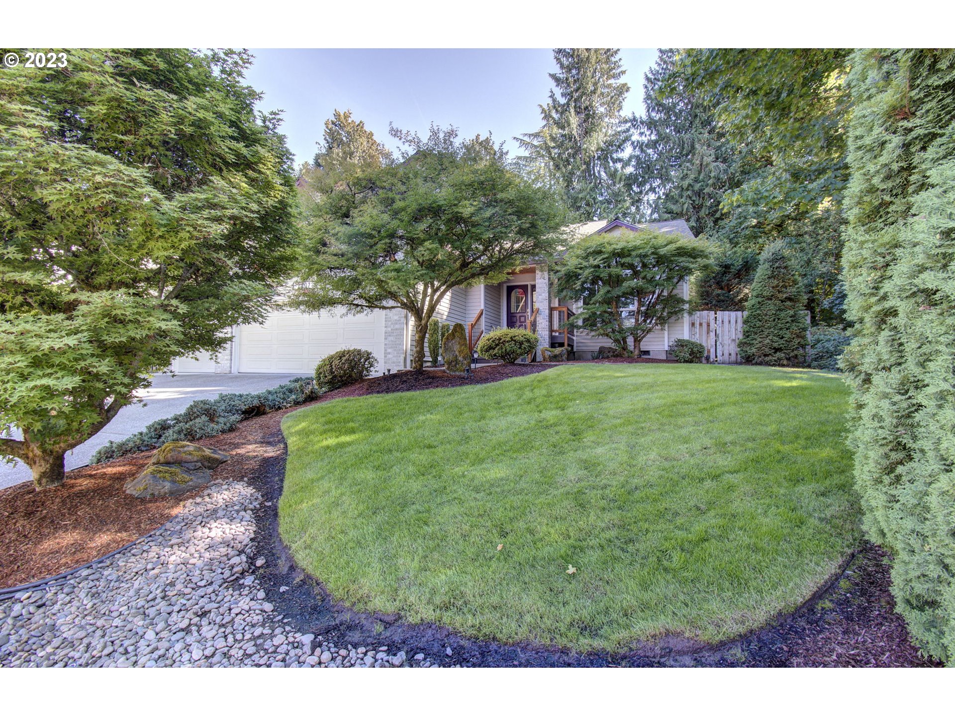2407 Northeast 165th Street Ridgefield, WA 98642 - Photo 2 of 46 a view of a yard with a house in the background
