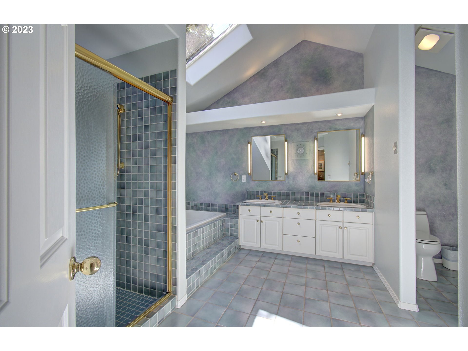 2407 Northeast 165th Street Ridgefield, WA 98642 - Photo 25 of 46 a bathroom with a granite countertop sink mirror and bathtub