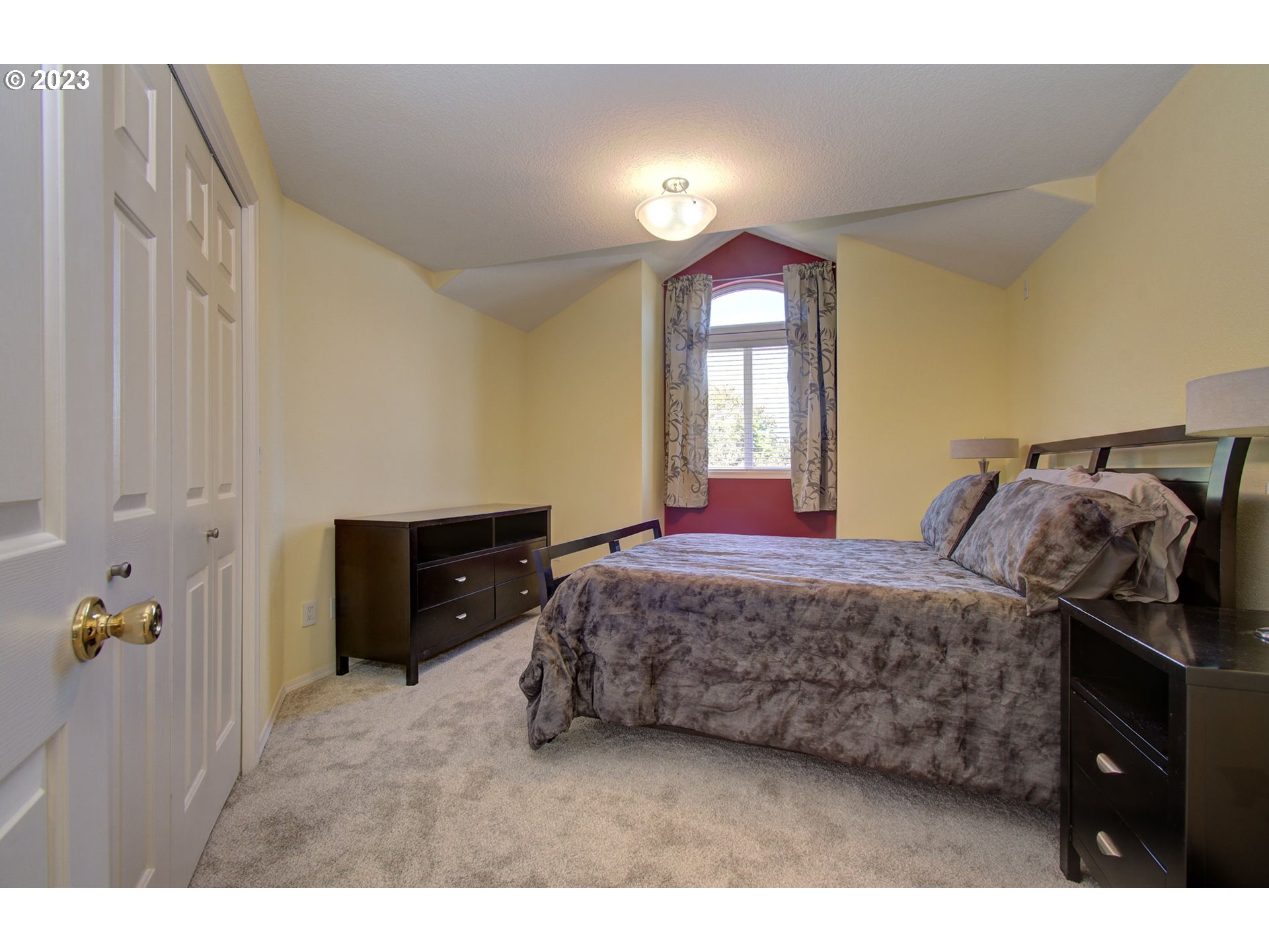 2407 Northeast 165th Street Ridgefield, WA 98642 - Photo 28 of 46 a bedroom with a bed and a lamp