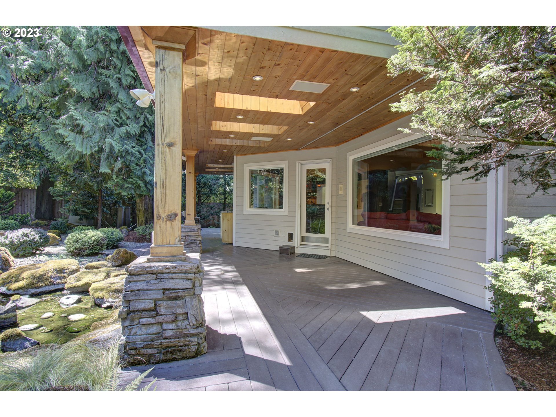 2407 Northeast 165th Street Ridgefield, WA 98642 - Photo 36 of 46 a view of a patio with table and chairs and potted plants