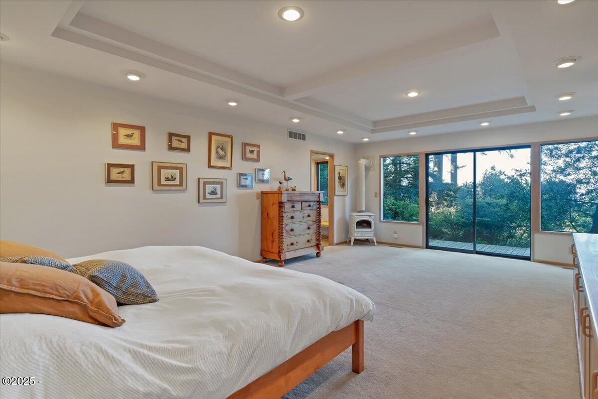 110 Ridge Crest Road Gleneden Beach, OR 97388 - Photo 39 of 72 a bed room with a bed and a large window