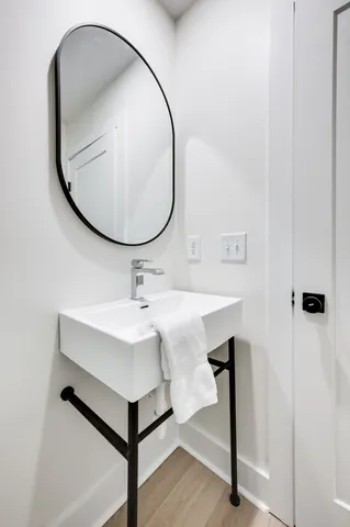 a bathroom with a sink a mirror and a toilet