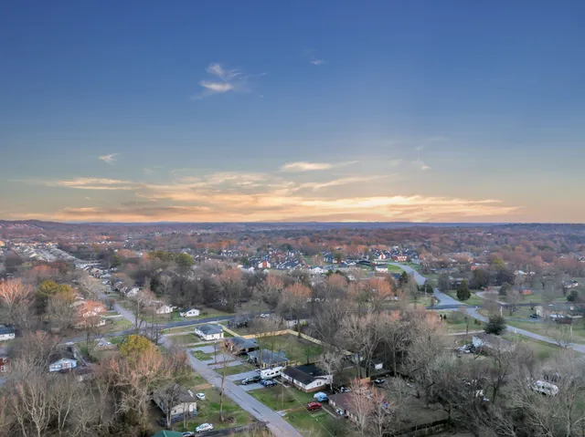 an aerial view of residential building and green space