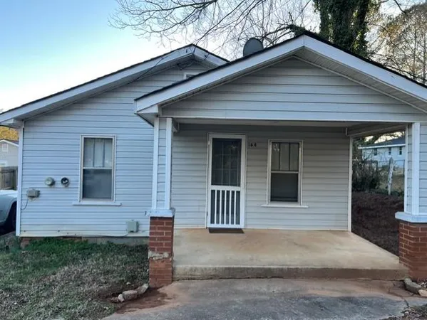 a front view of a house with garage