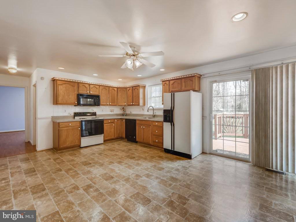 1407 Kent Road Essex, MD 21221 - Photo 5 of 22 The light filled kitchen opens onto the Deck