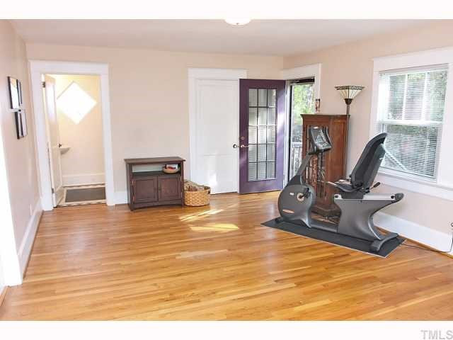 413 West Aycock Street Raleigh, NC 27608 - Photo 6 of 12 Another view of the fully updated family room! This area would be perfect to be used as an office/home business as it is has access to bathroom and to side parking! Living Room