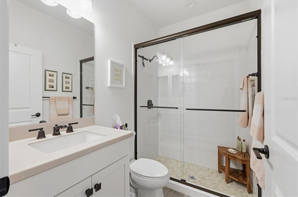 216 Brienza Loop Nokomis, FL 34275 - Photo 23 of 58 a bathroom with a sink mirror vanity and toilet