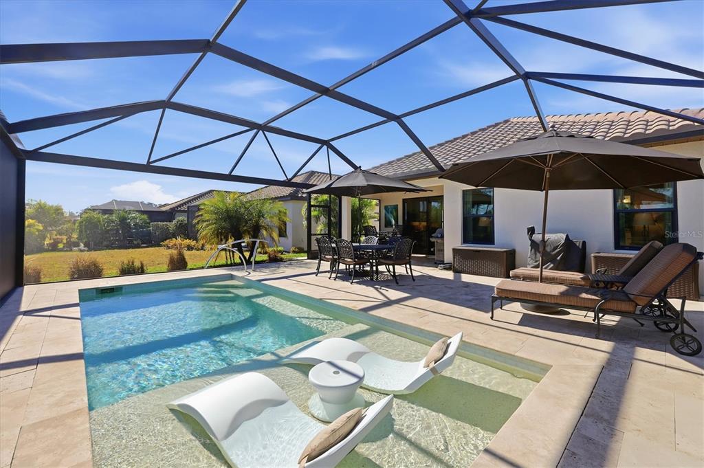 216 Brienza Loop Nokomis, FL 34275 - Photo 32 of 58 a view of a backyard with sitting area