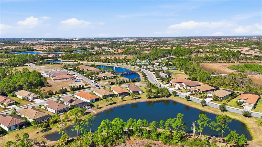 216 Brienza Loop Nokomis, FL 34275 - Photo 39 of 58 an aerial view of residential houses with outdoor space
