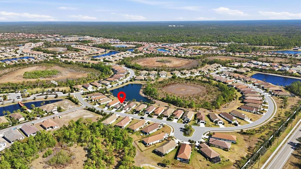 216 Brienza Loop Nokomis, FL 34275 - Photo 40 of 58 an aerial view of residential houses with outdoor space