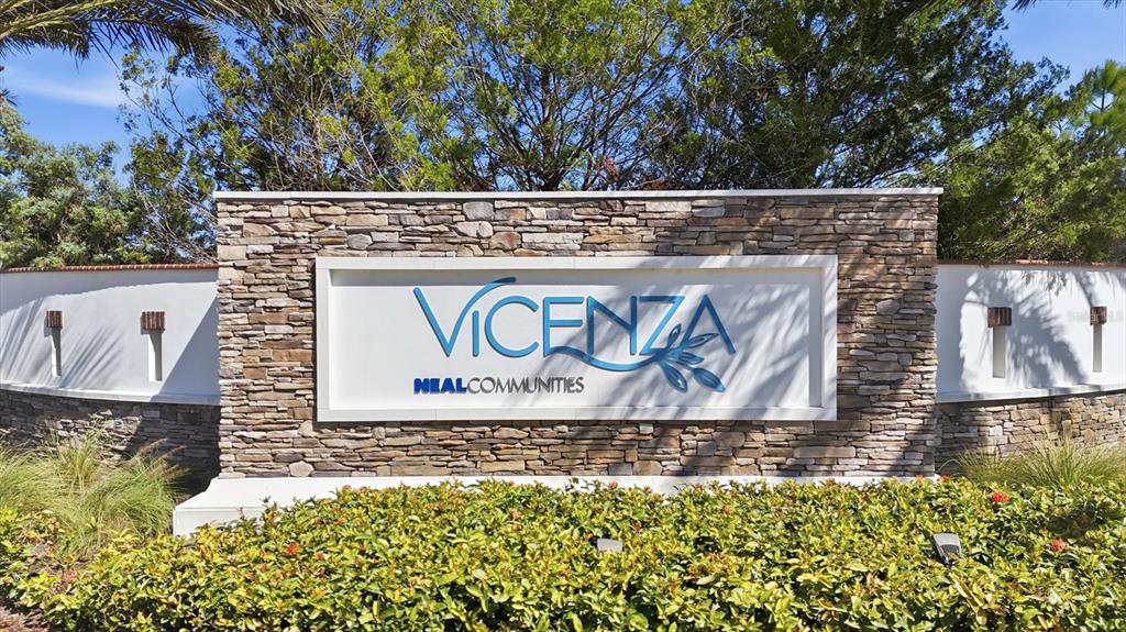 216 Brienza Loop Nokomis, FL 34275 - Photo 42 of 58 a view of outdoor space with signage and flags