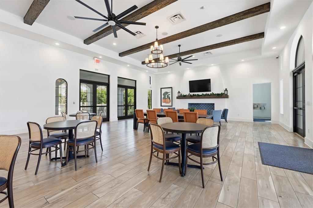 216 Brienza Loop Nokomis, FL 34275 - Photo 44 of 58 a view of a dining room with furniture window and wooden floor