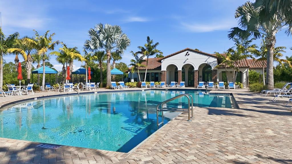 216 Brienza Loop Nokomis, FL 34275 - Photo 46 of 58 a view of outdoor space with swimming pool and lounge chair