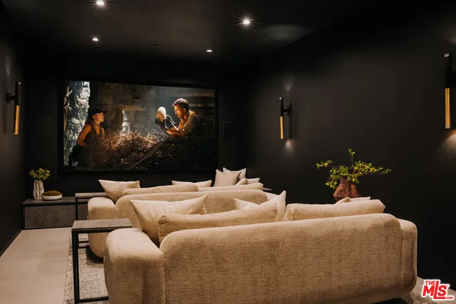 a bathroom with a granite countertop toilet sink and mirror