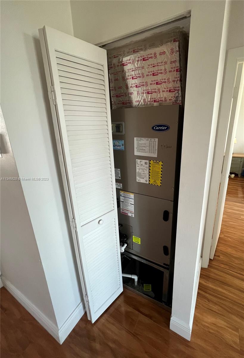 Towngate Pembroke Pines, FL 33028 - Photo 11 of 31 a view of a hallway with wooden floor and staircase