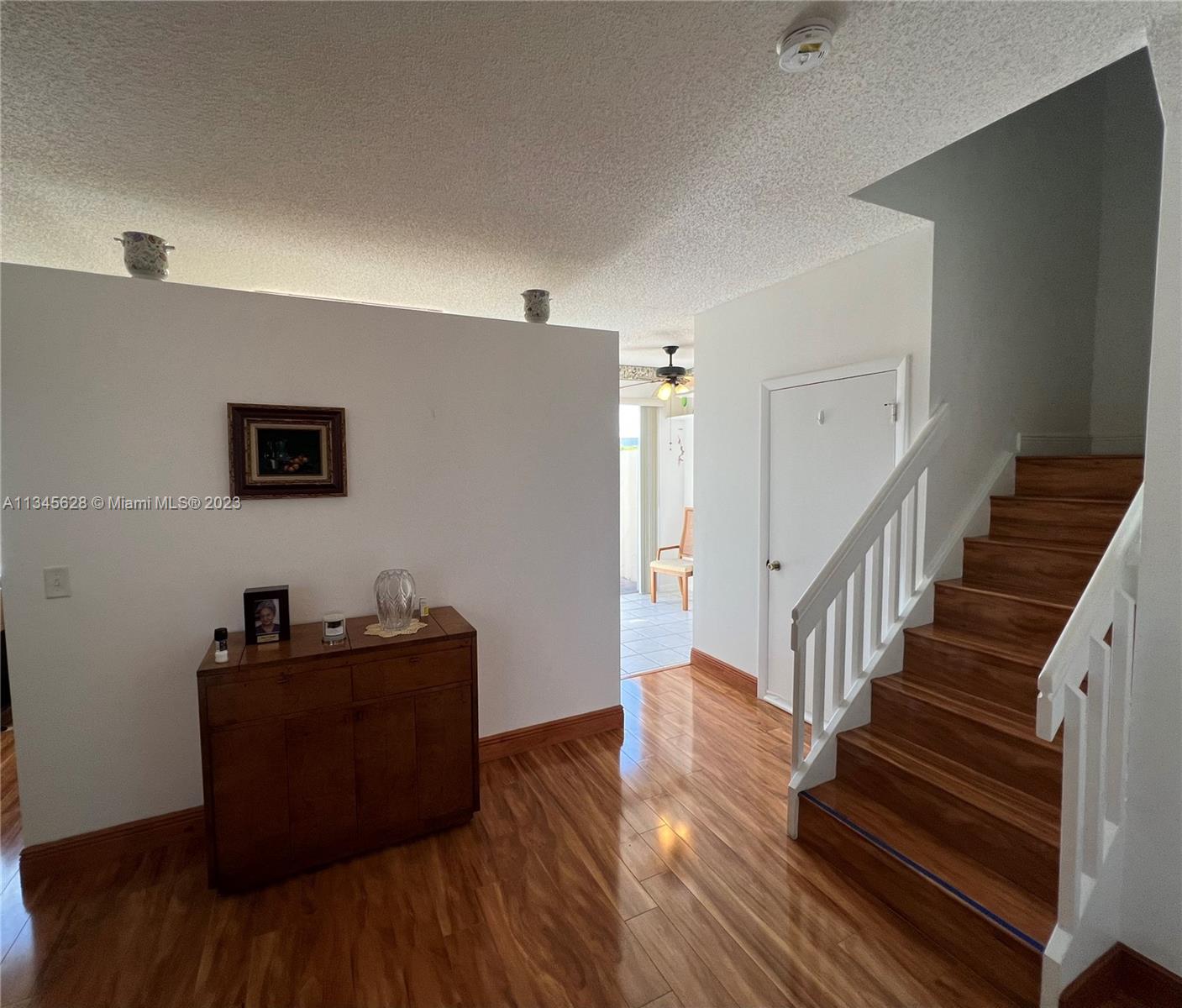 Towngate Pembroke Pines, FL 33028 - Photo 17 of 31 a view of a livingroom with wooden floor and stairs