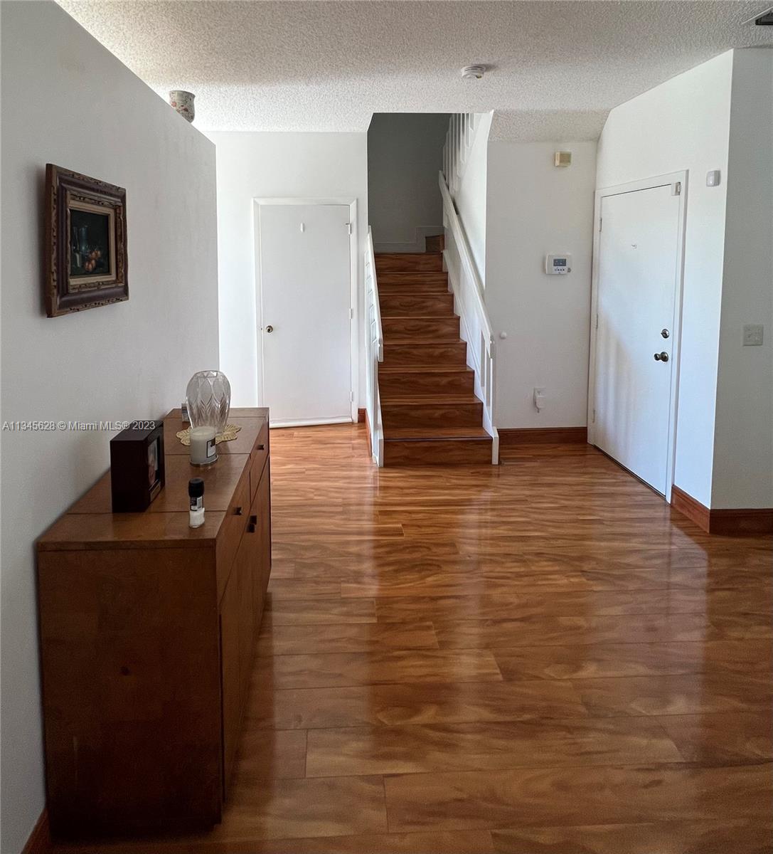 Towngate Pembroke Pines, FL 33028 - Photo 18 of 31 a room with table and chair