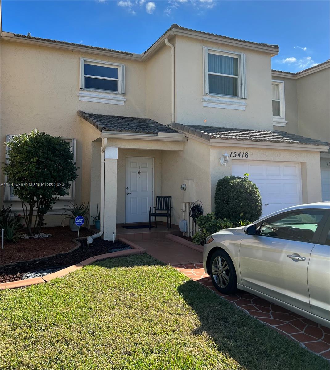 Towngate Pembroke Pines, FL 33028 - Photo 2 of 31 a car parked in front of a house