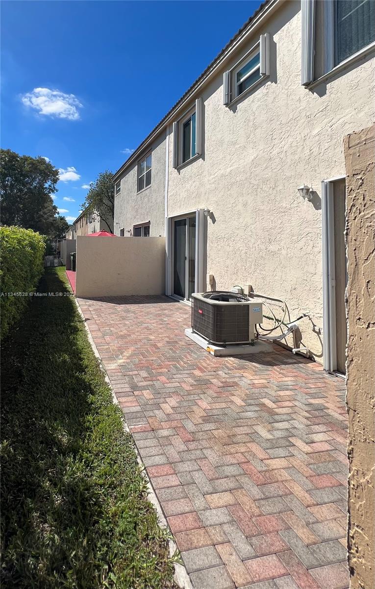 Towngate Pembroke Pines, FL 33028 - Photo 21 of 31 a front view of a house with a yard