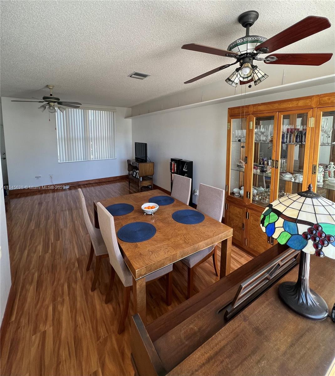 Towngate Pembroke Pines, FL 33028 - Photo 29 of 31 a view of a dining room with furniture window and wooden floor
