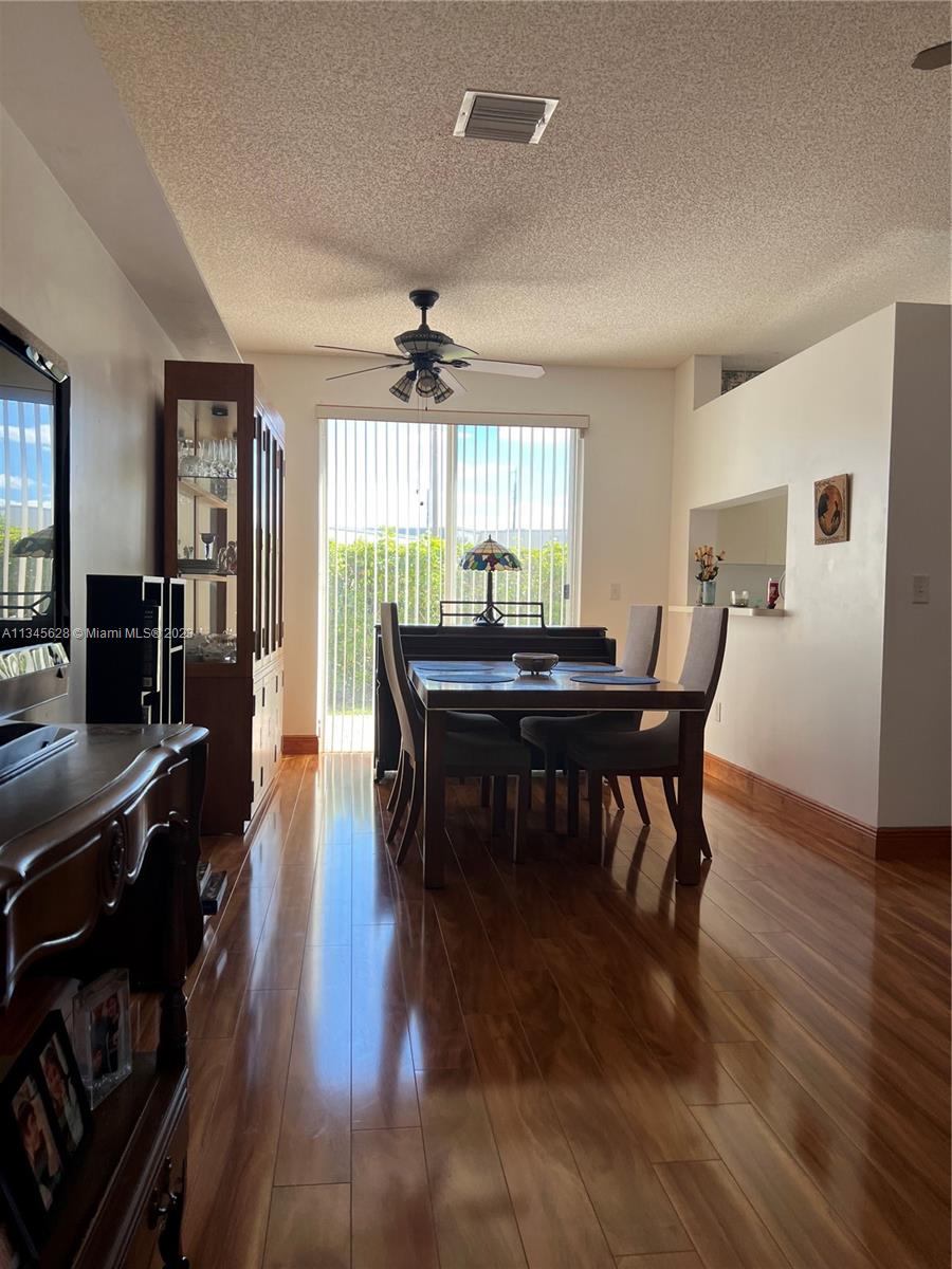 Towngate Pembroke Pines, FL 33028 - Photo 31 of 31 a view of a a dining room with furniture window and wooden floor