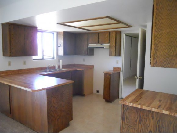 1960 W Road Chino Valley, AZ 86323 - Photo 4 of 12 a kitchen with a sink and a refrigerator