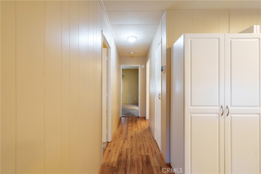 4000 Pierce Street, Unit 72 Riverside, CA 92505 - Photo 11 of 20 a view of a hallway with wooden floor