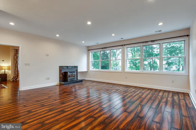 a view of a living room and kitchen with furniture