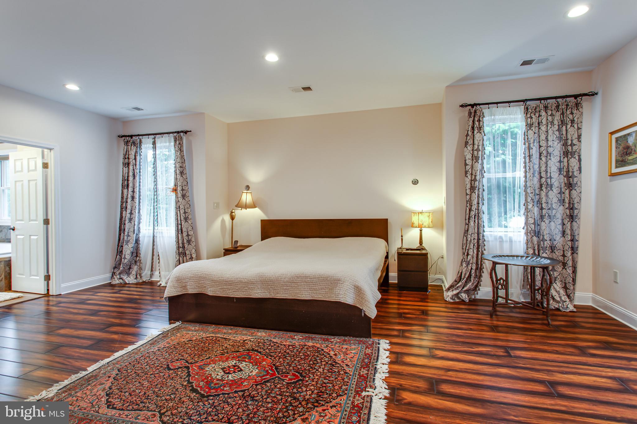 43840 Tarrywyle Way Leonardtown, MD 20650 - Photo 15 of 41 a bedroom with a bed and wooden floor