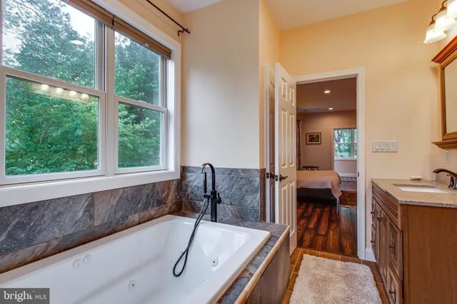 a bathroom with a shower and a sink