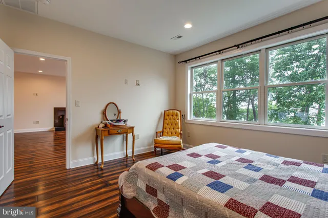 a view of room with window and wooden floor