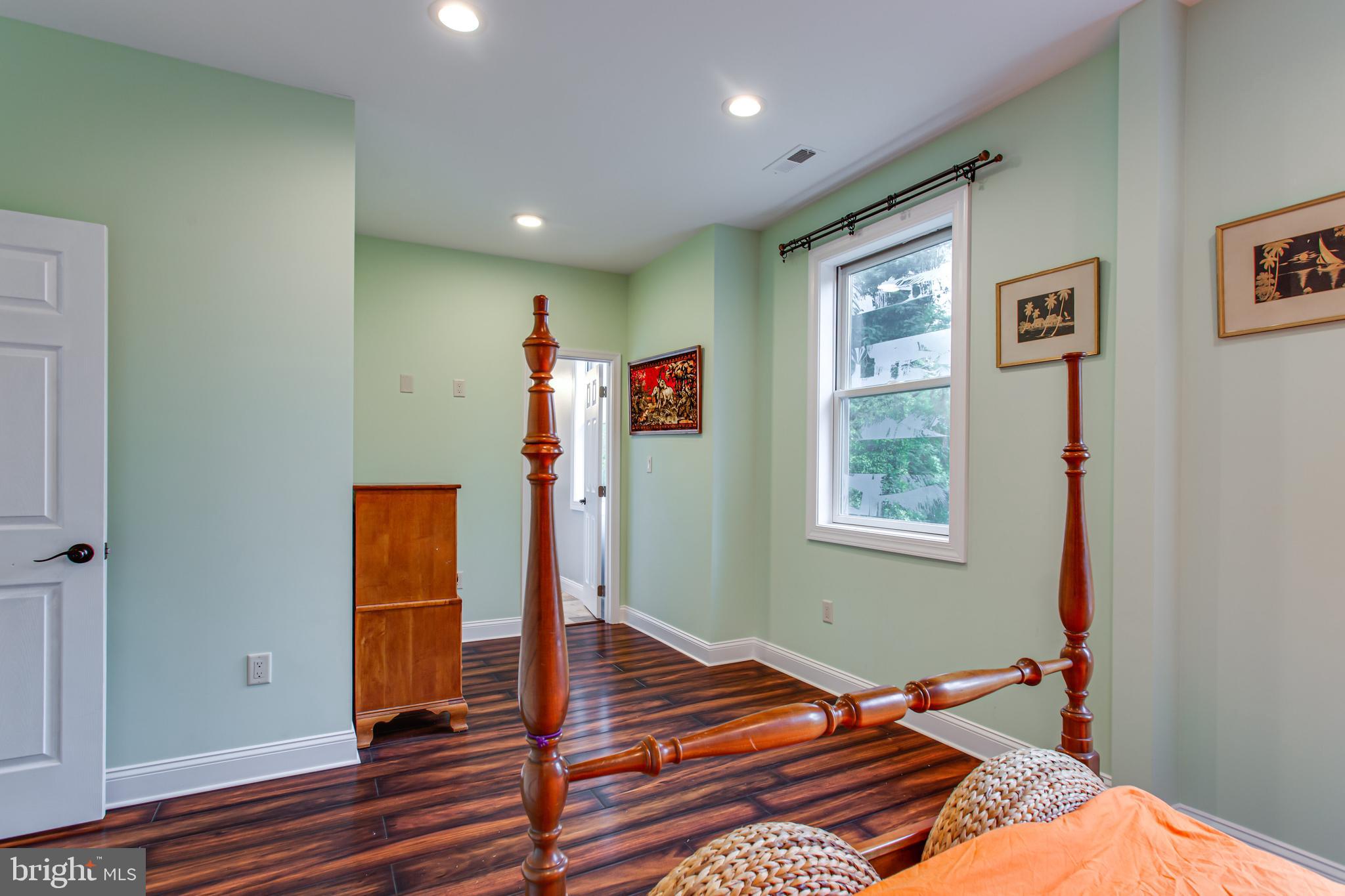 43840 Tarrywyle Way Leonardtown, MD 20650 - Photo 27 of 41 a bedroom with a bed and wooden floor