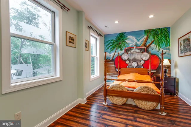 a bathroom with a granite countertop sink a mirror and a shower