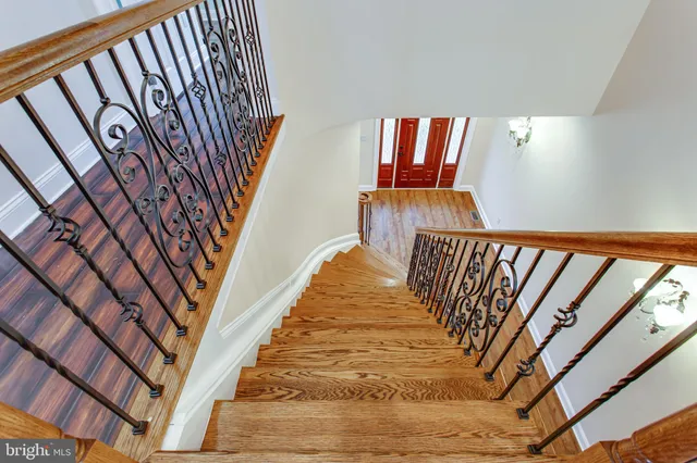 a living room with fireplace furniture and a wooden floor