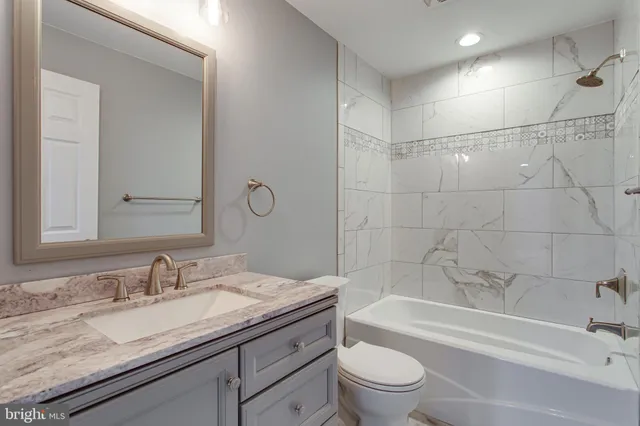 a balcony with furniture and wooden floor