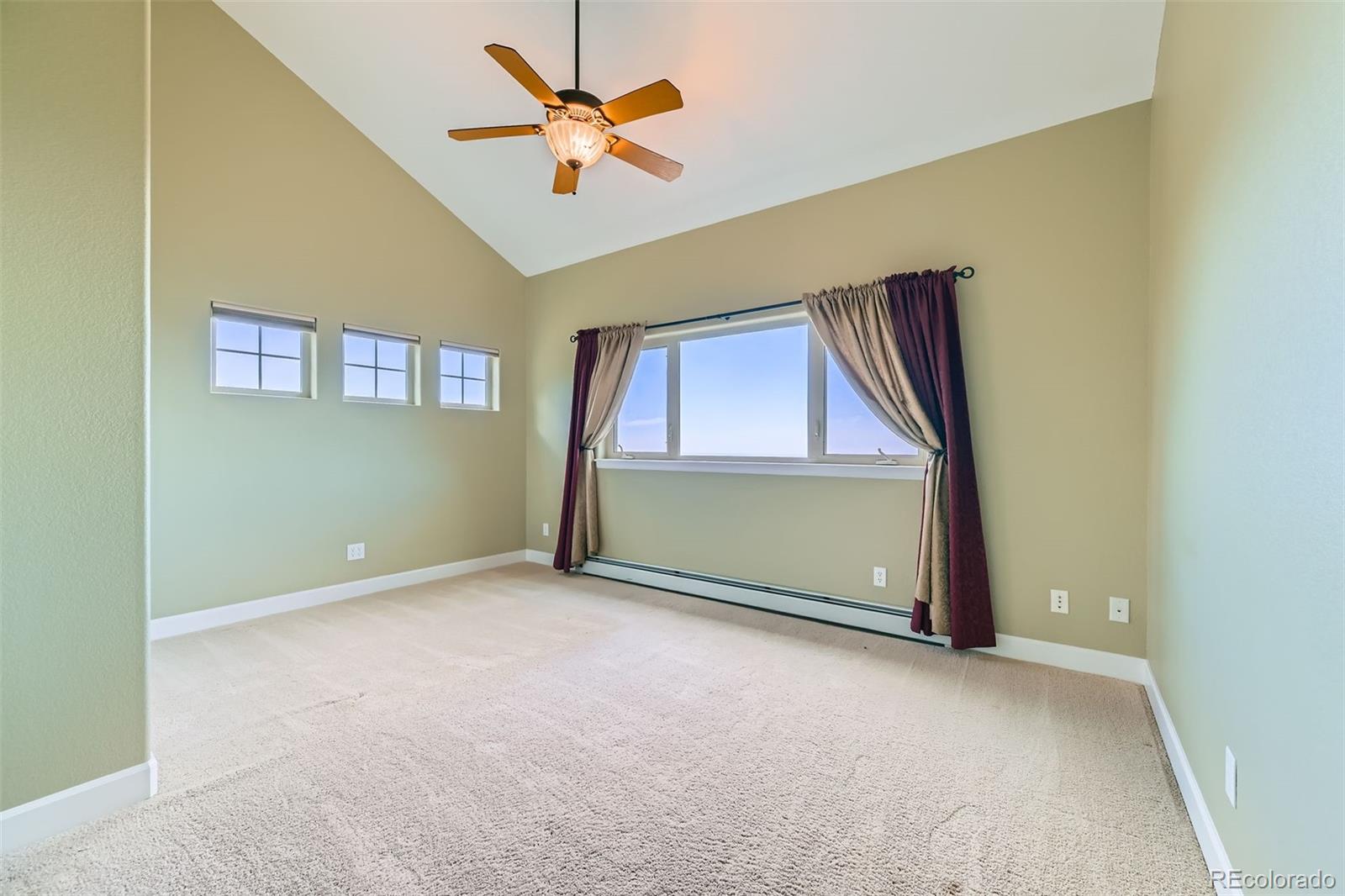 570 Upper Vista Road Manitou Springs, CO 80829 - Photo 26 of 36 an empty room with a ceiling fan and a window
