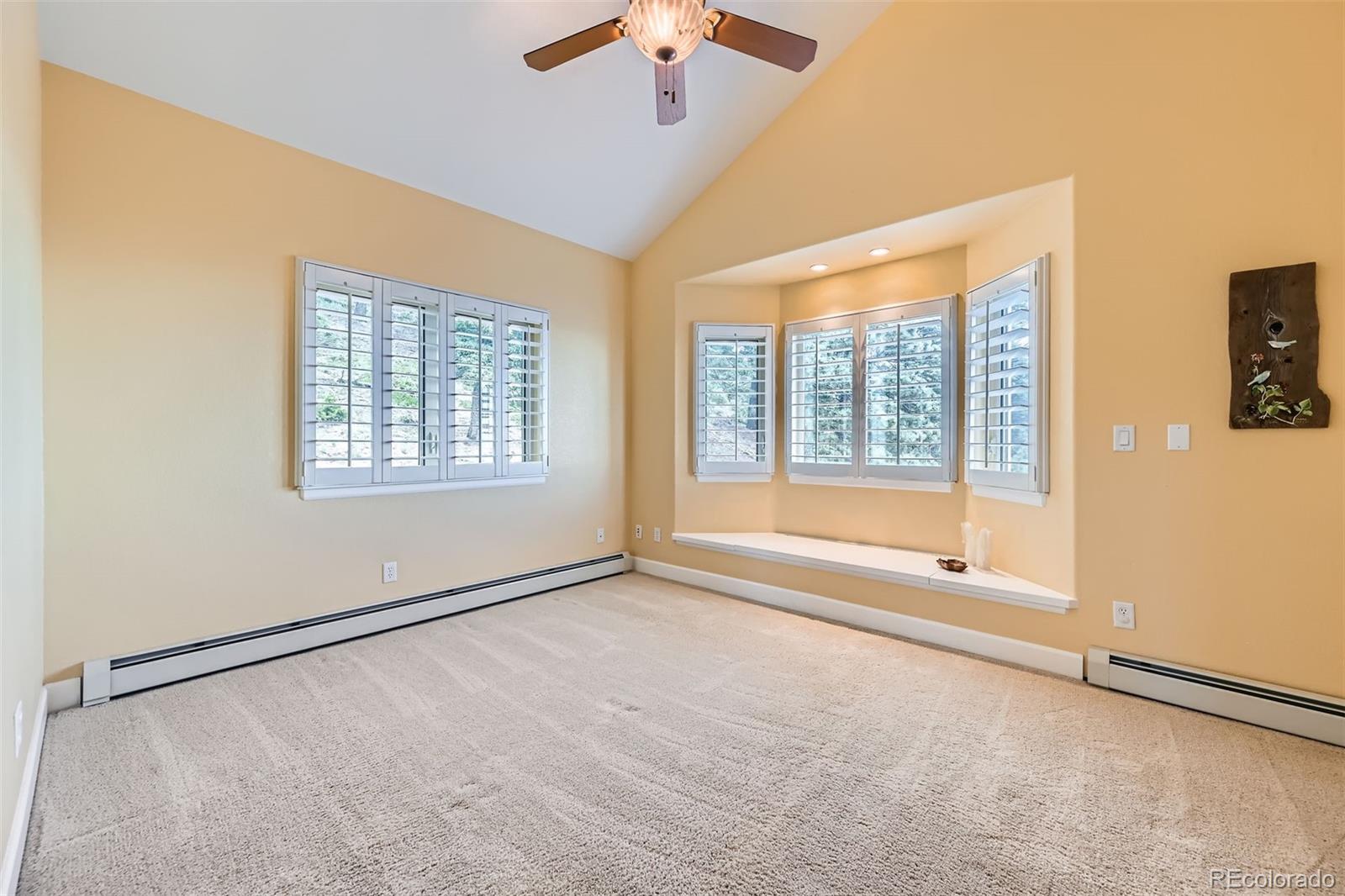 570 Upper Vista Road Manitou Springs, CO 80829 - Photo 27 of 36 a view of an empty room with a window