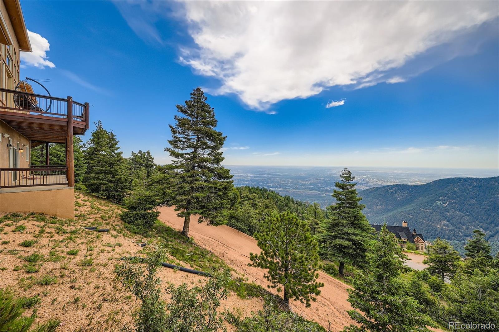 570 Upper Vista Road Manitou Springs, CO 80829 - Photo 3 of 36 a view of a house with a yard