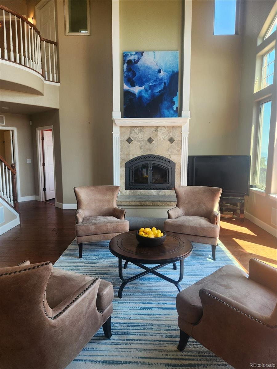 570 Upper Vista Road Manitou Springs, CO 80829 - Photo 6 of 36 a living room with furniture a fireplace and window
