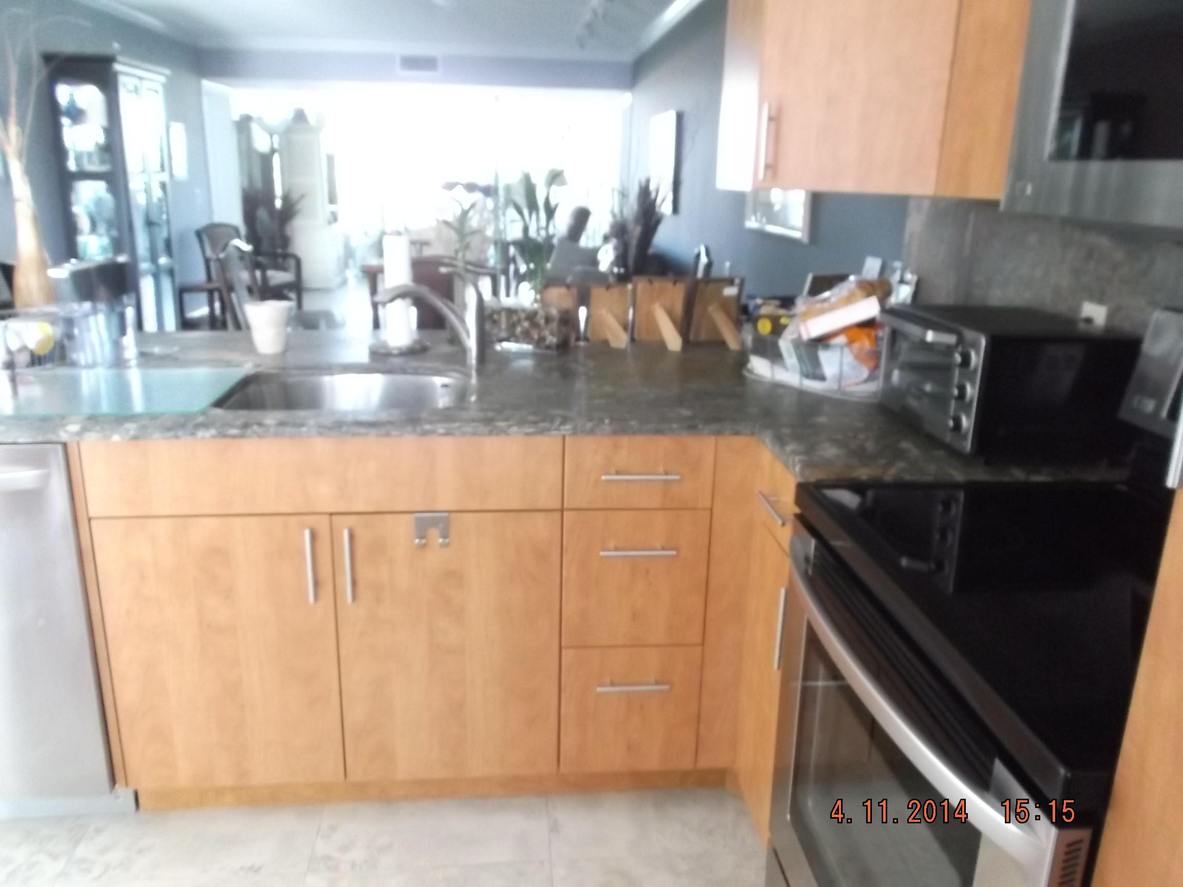 a kitchen with a sink and cabinets
